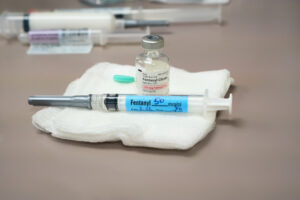 a bottle of fentanyl citrate with a syringe