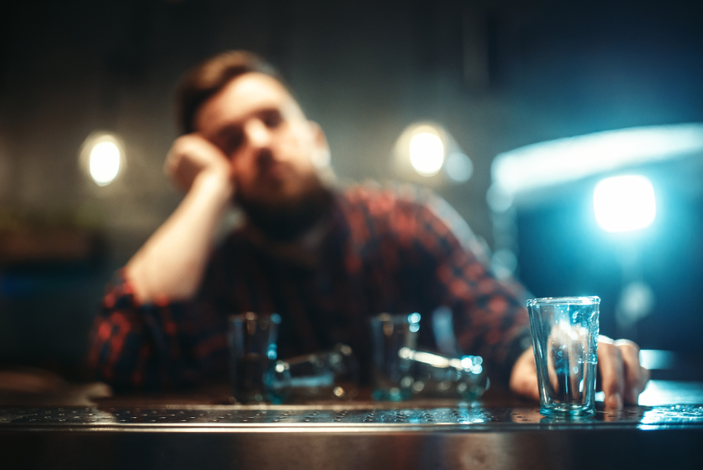 blurred man drinking alcohol