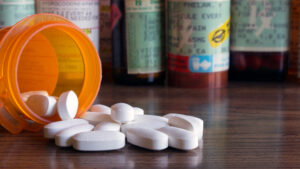 white opioid pills in bottle