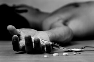 man experiencing symptoms of heroin addiction heroin overdose