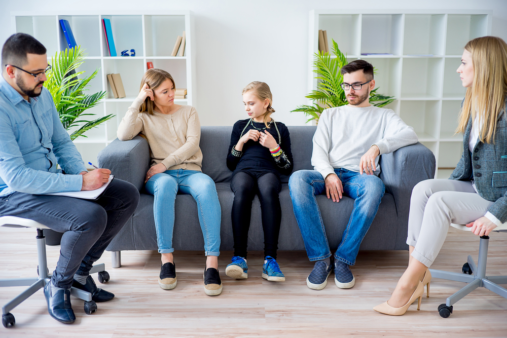 teenager in family therapy session